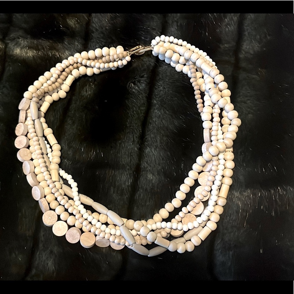 Multi-strand statement necklace in shades of cream
